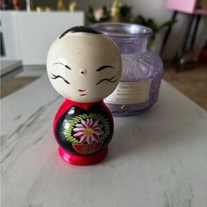 Colorful Doll Figurine with Floral Design coin collector